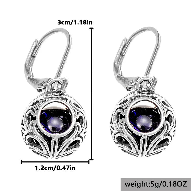Women's silver geometric hollow pendant earrings with vintage engraving and blue gemstone accents