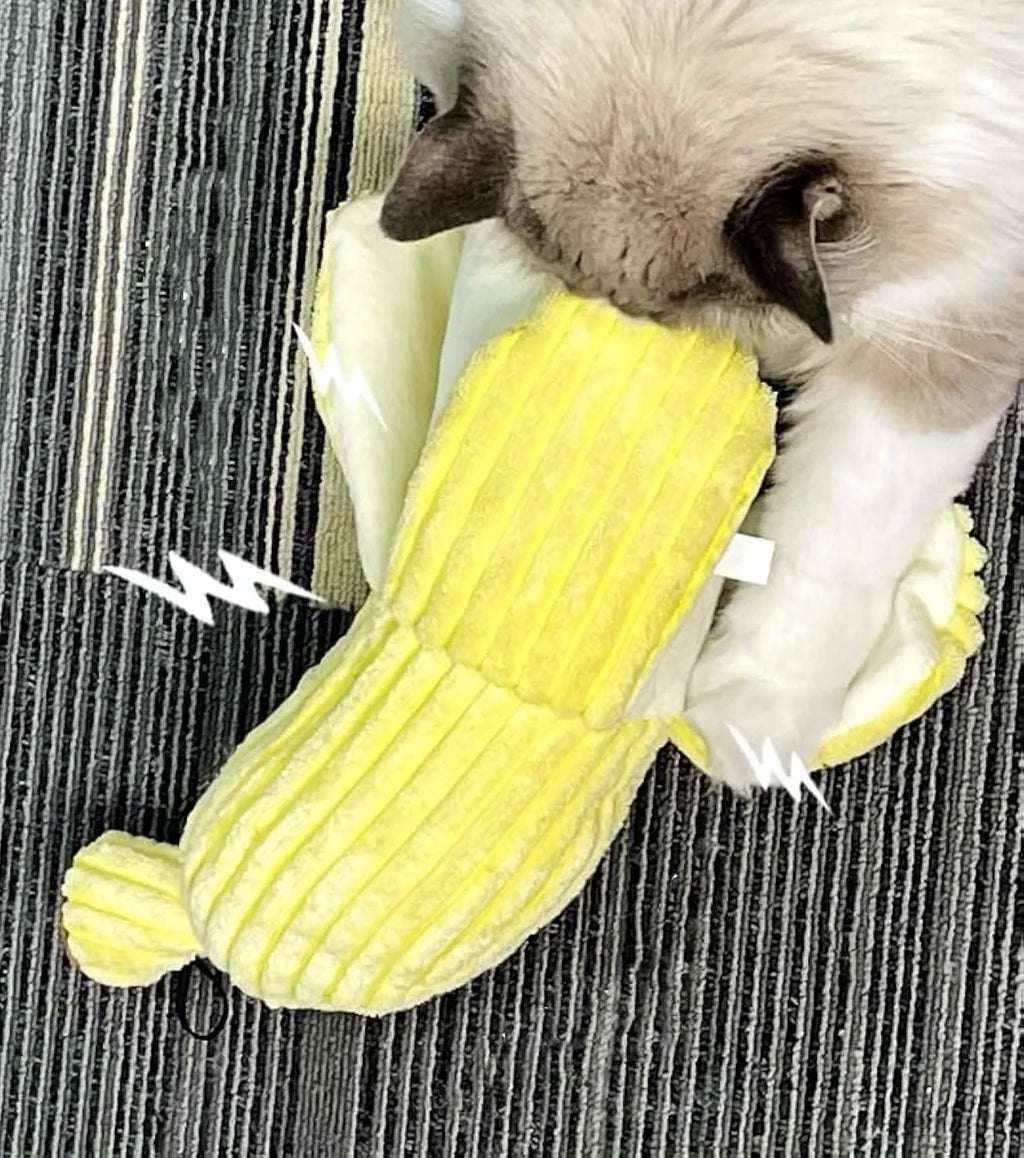 Yellow banana-shaped cat toy with soft plush texture and crinkle paper sound element