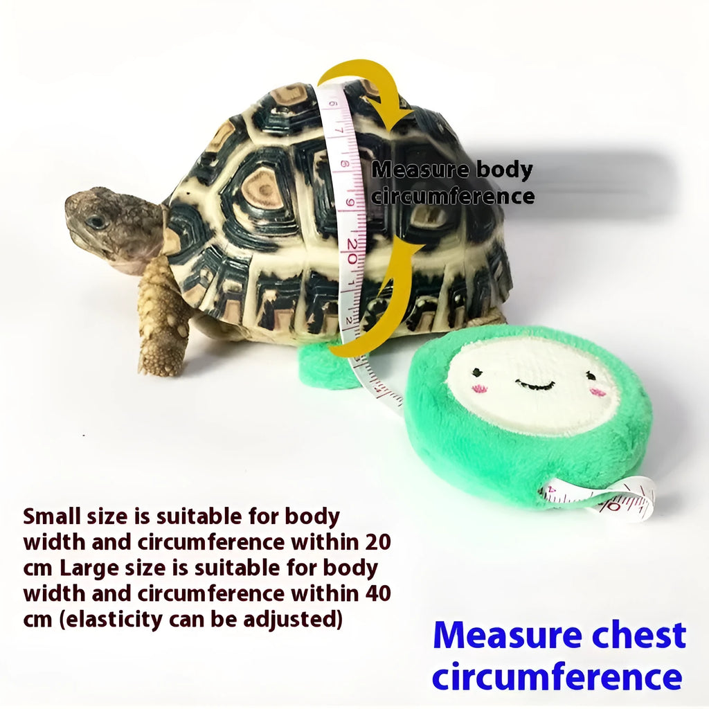 Yellow adjustable turtle vest harness with bell and traction rope on a small pet turtle