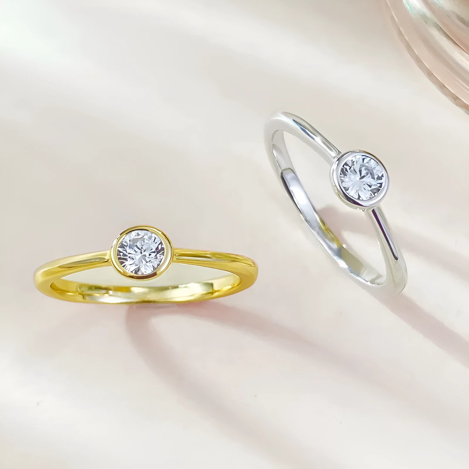 Minimalist silver crown-shaped ring with linear design, shown in electroplated gold and platinum finishes.