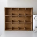 Solid wood cup storage rack with multiple square grids in birch wood meridian colour