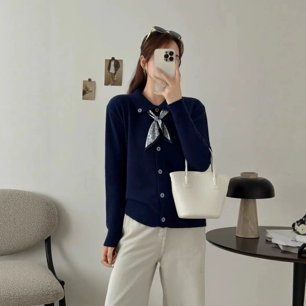 Ladies' grey lapel scarf cardigan sweater on a hanger