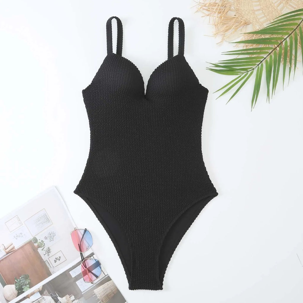 Women's sleeveless one-piece swimsuit in polyester for swimming, shown in solid colour options.