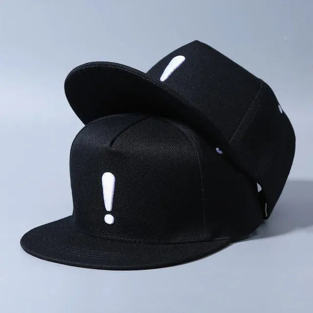 Cotton baseball cap with embroidered exclamation mark, adjustable dome crown, in black