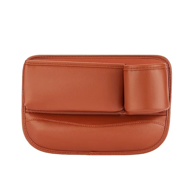 Car seat gap storage box in black leather with built-in water cup holder, fitted between driver seat and centre console