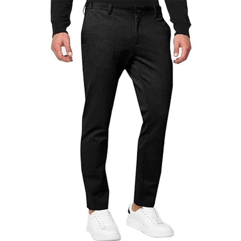 Men's slim-fit tapered chino trousers in a solid colour, showing the tapered leg and casual style.