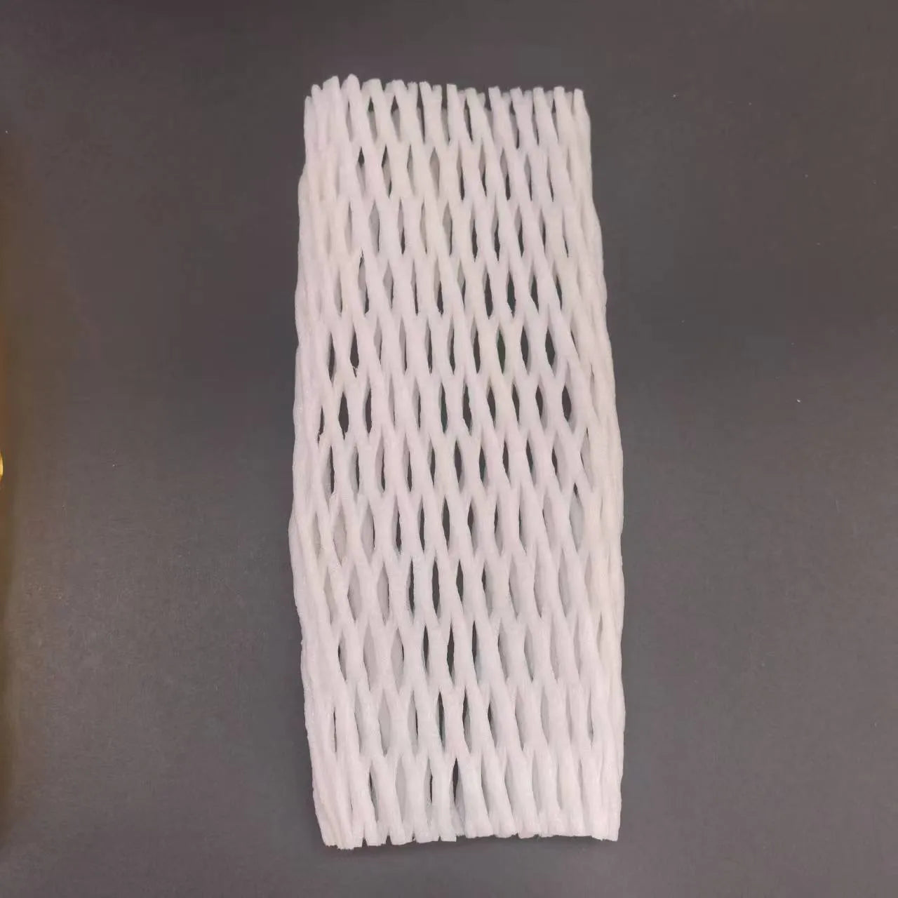 White foam net protective sleeve for apples and oranges, shown in various sizes.