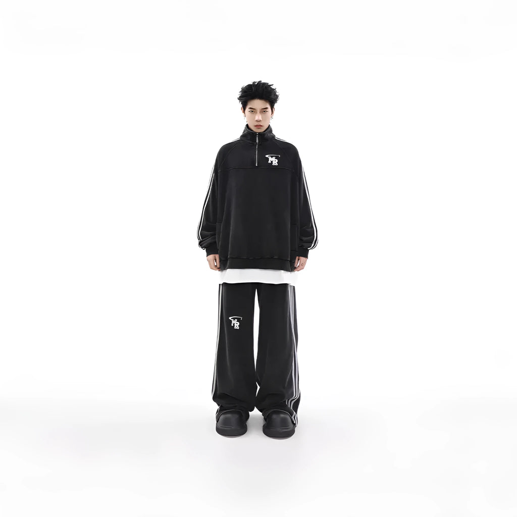 Black Hong Kong style polyester sports hoodie with stand collar and long sleeves on a hanger.