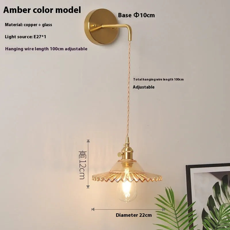 Retro brass bedside lotus wall lamp with glass shade in transparent finish, copper body, 22cm diameter