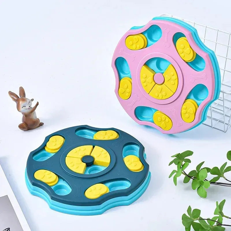 Blue and pink dog puzzle toy feeder bowl for aggressive chewers on a wooden floor.