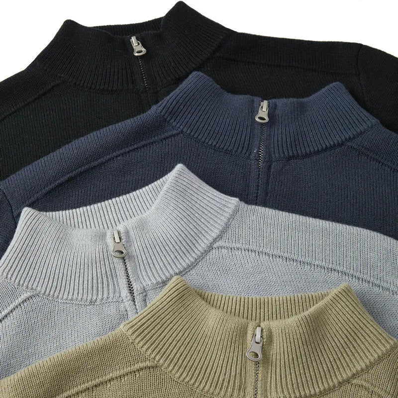 Man wearing a slim fit grey wool pullover sweater with long sleeves.