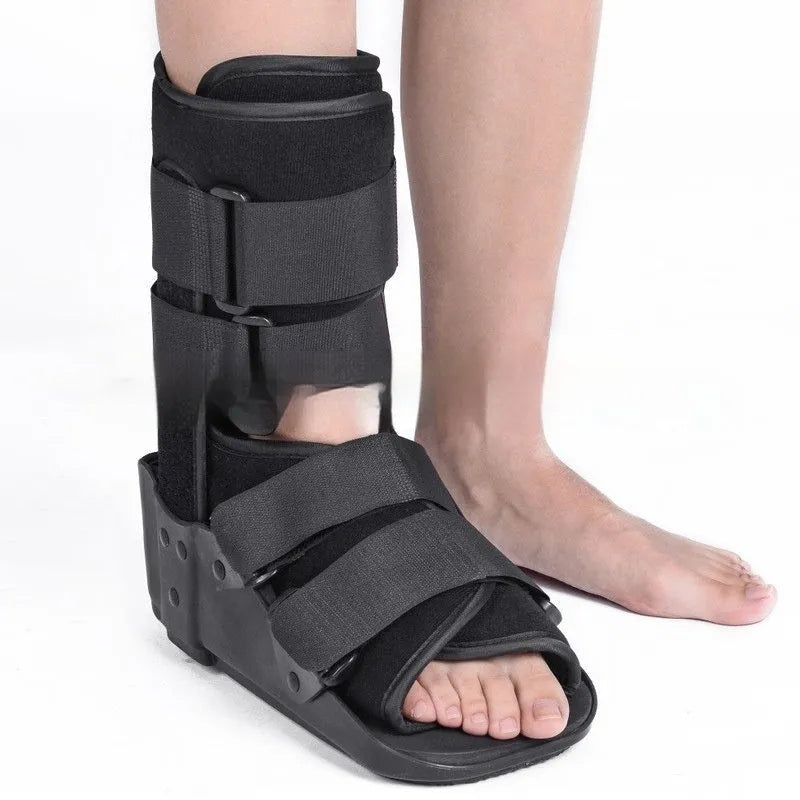 Grey Achilles tendon rehabilitation walking boot with fixed support design and adjustable sizing