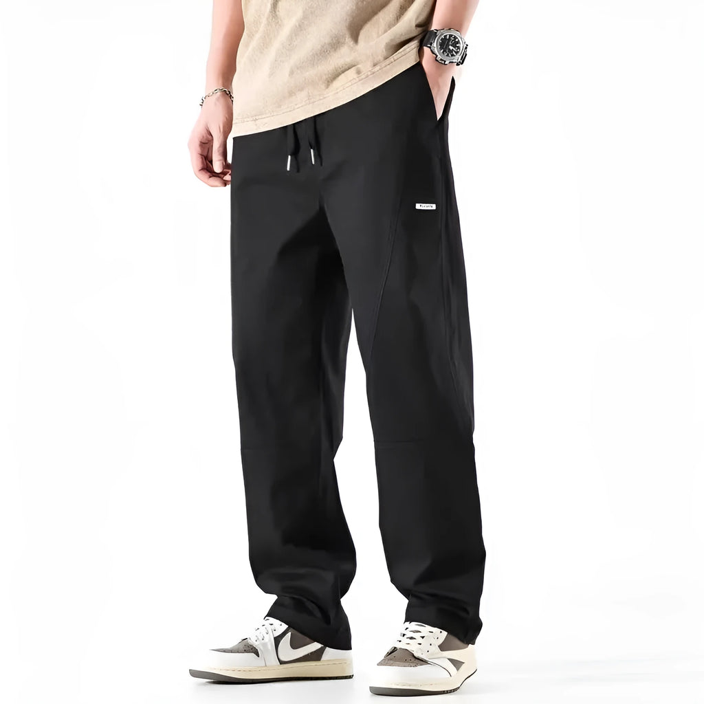 Cotton wide-leg casual trousers in milky white and black colours, showcasing the relaxed fit.