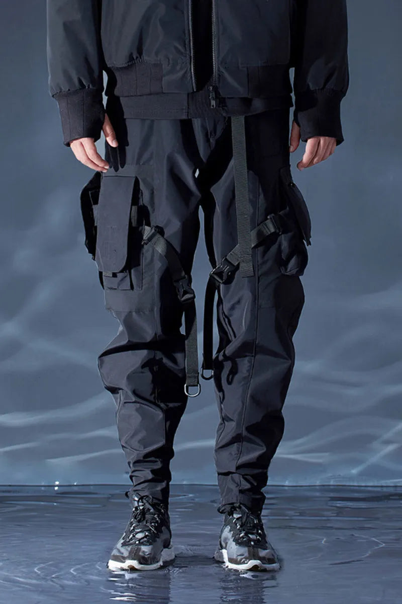 Black waterproof paratrooper trousers with integrated pant straps and 100% polyester fibre construction