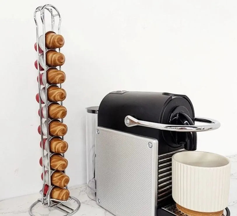 Black wrought iron coffee capsule storage rack holding 20 single-serve pods on display shelves.