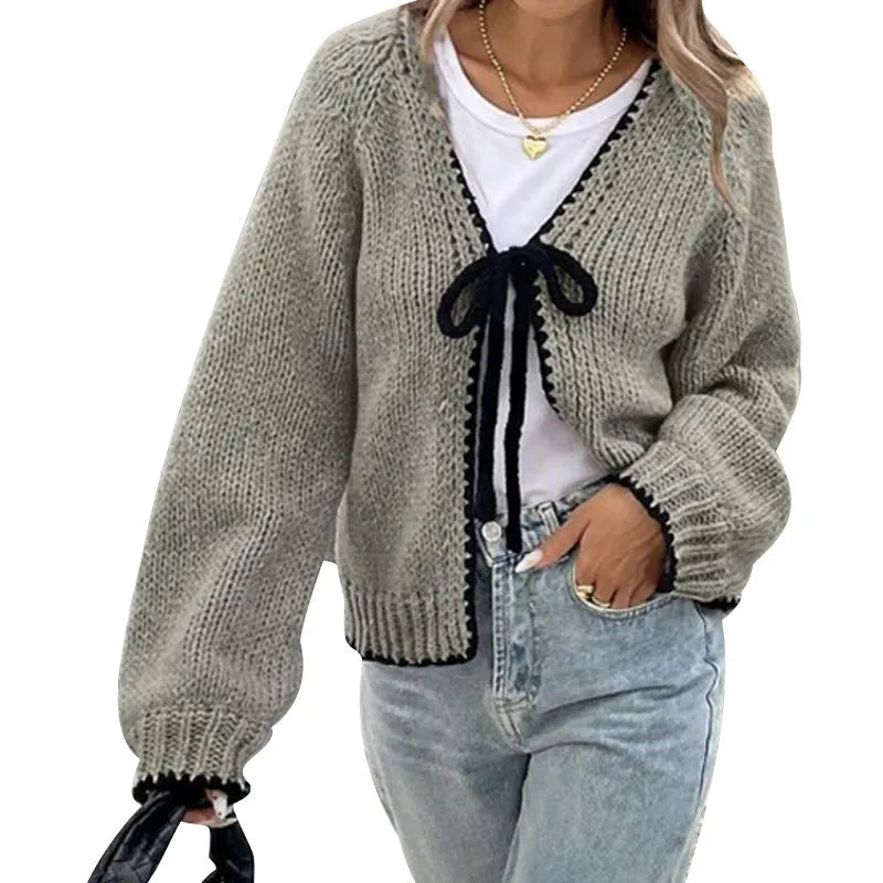 Women's gray loose-fit cardigan with crocheted flower detail on the front