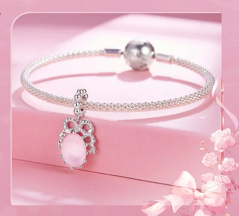 925 silver bow pendant with electroplated finish, height 2.4cm, width 1.2cm, on white background