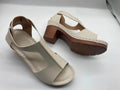 Peep toe wedge sandals with Roman style buckle and fish mouth open toe design in creamy-white colour