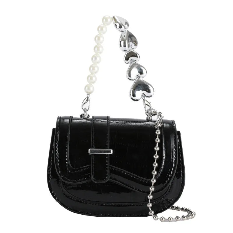 Silver laser pearl tote saddle mini crossbody bag for women on a model