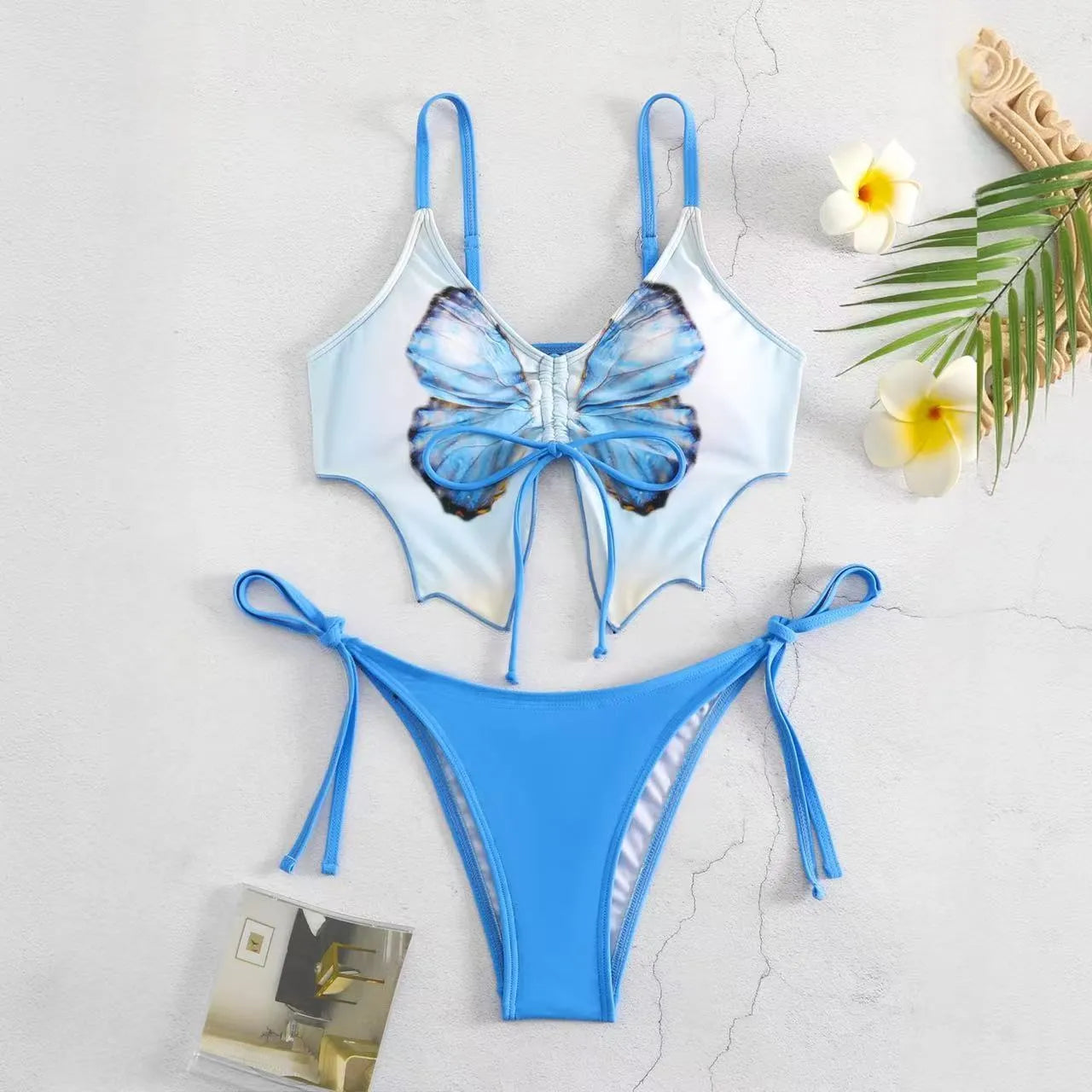 Women's purple bow ins style split bikini set with briefs, on a mannequin.