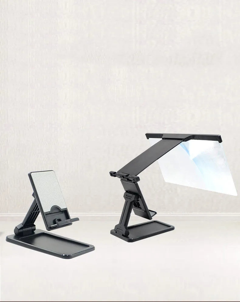 Black folding mobile phone screen amplifier with detachable holder on desktop