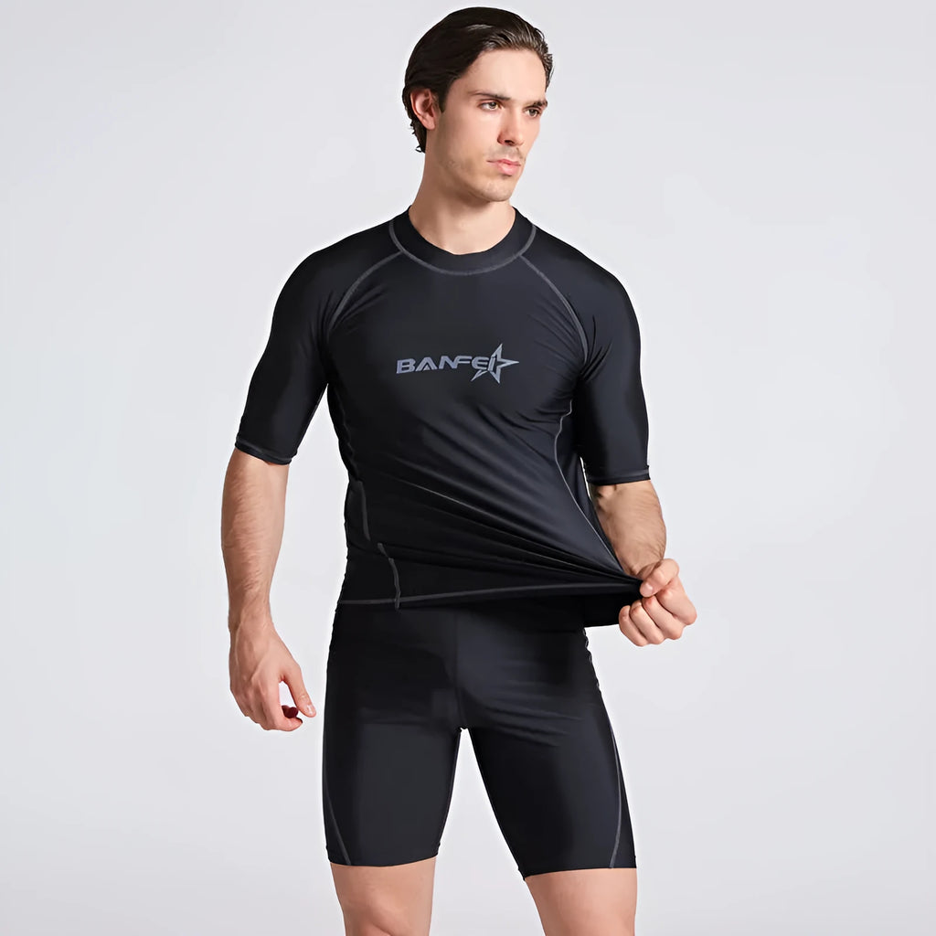 Men's half-sleeve nylon swimsuit set in blue for snorkelling and surfing with matching top and pants