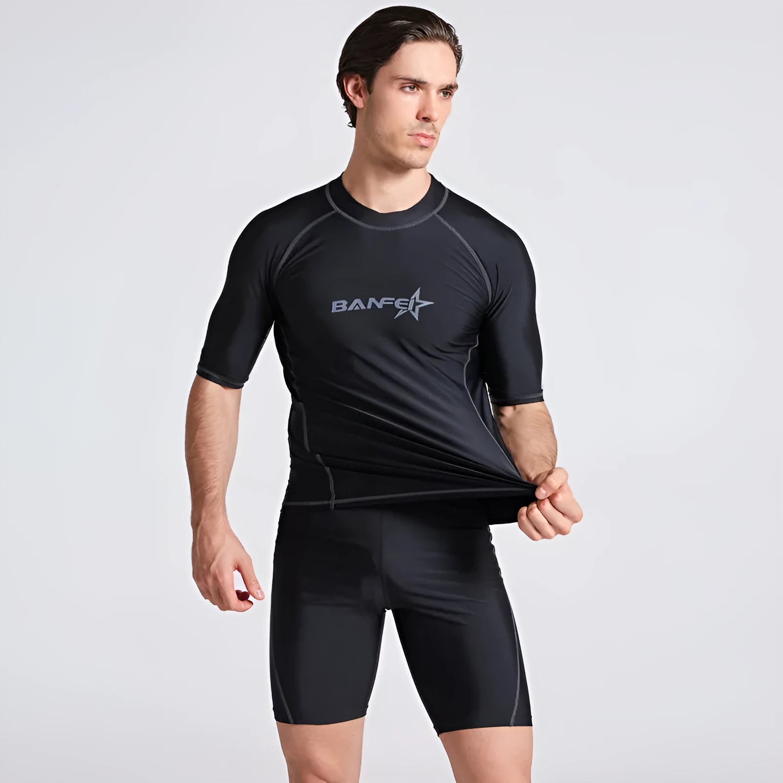 Men's half-sleeve nylon swimsuit set in blue for snorkelling and surfing with matching top and pants