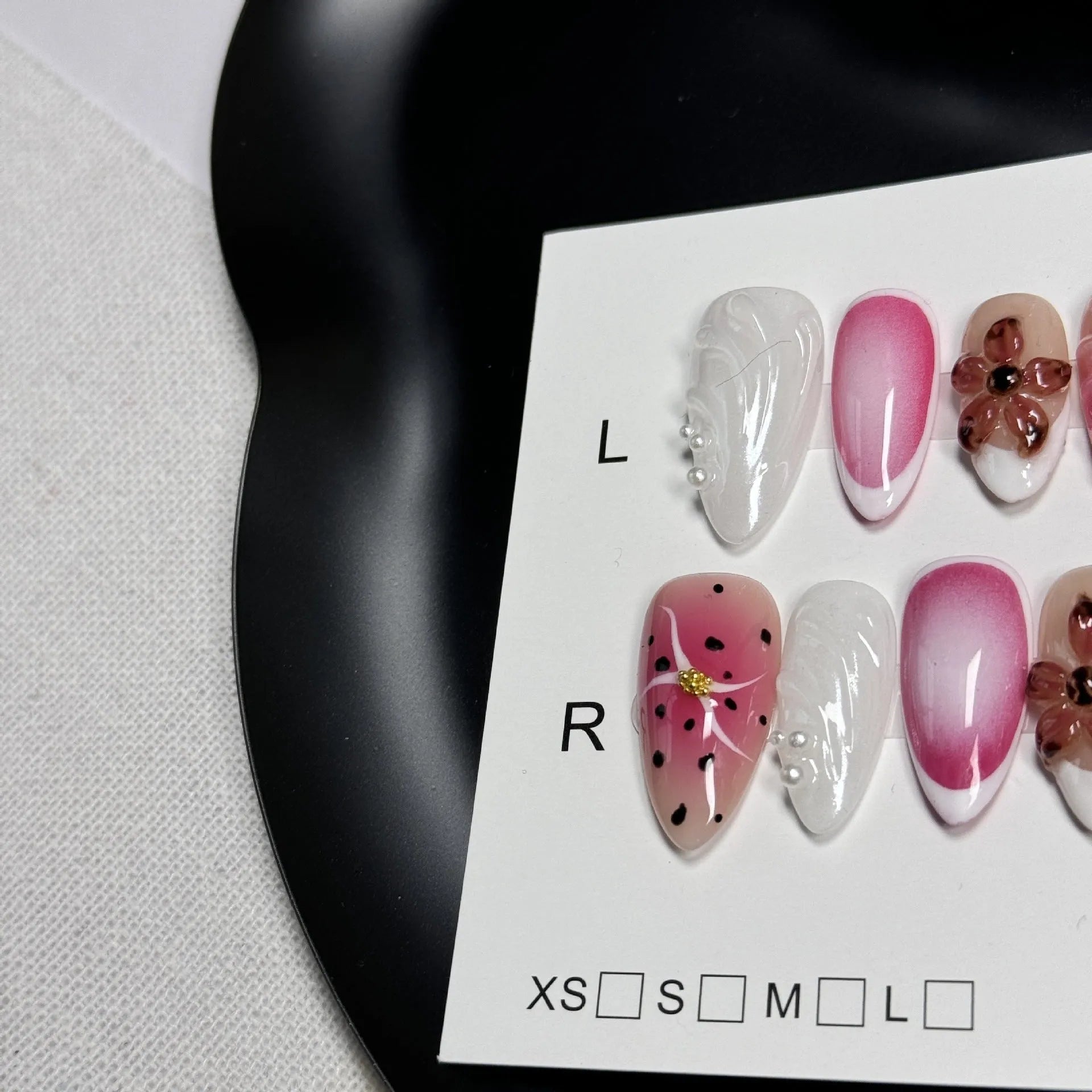 Hand-painted three-dimensional nail patches with embossed candy patterns in almond shape