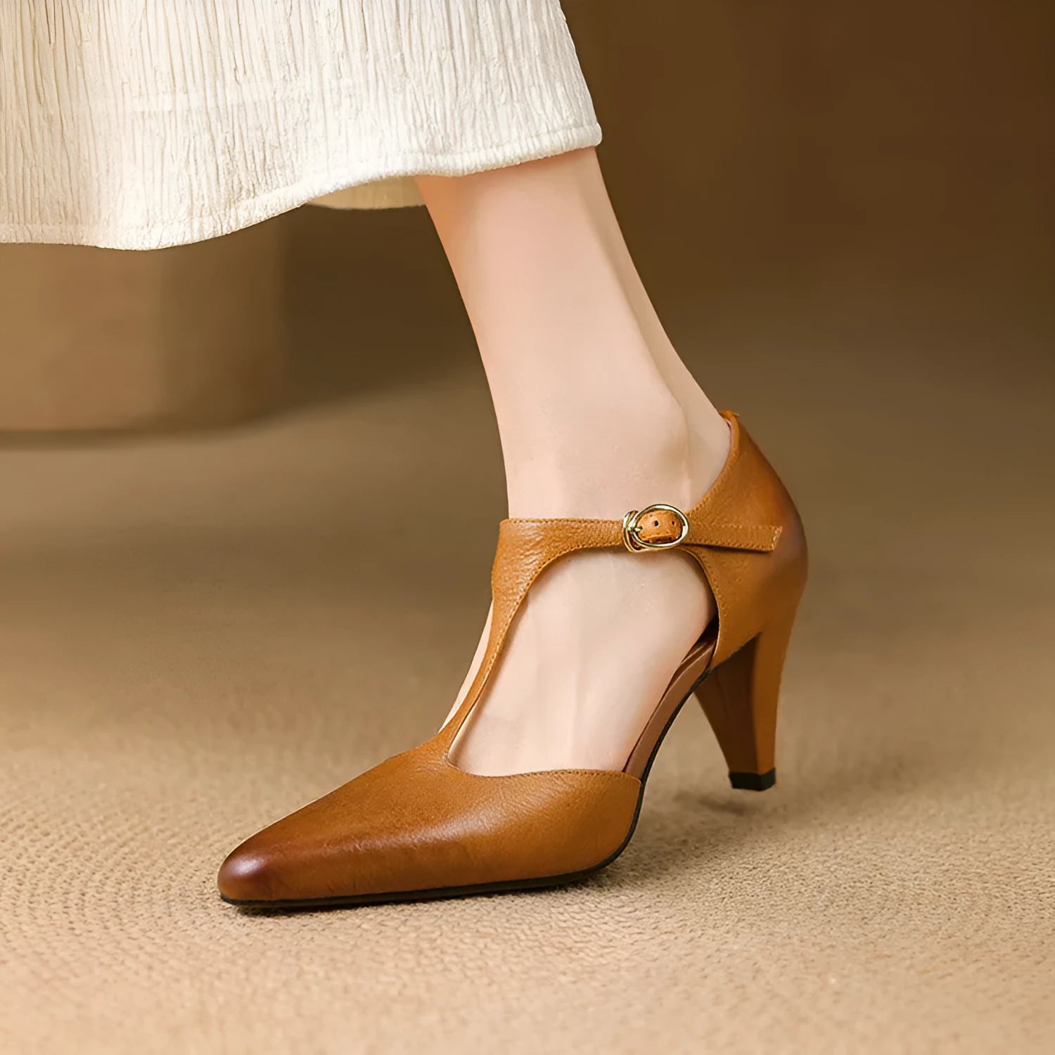 Brown retro women's sandals with a T-strap, buckle, closed round toe, and a short stout heel.