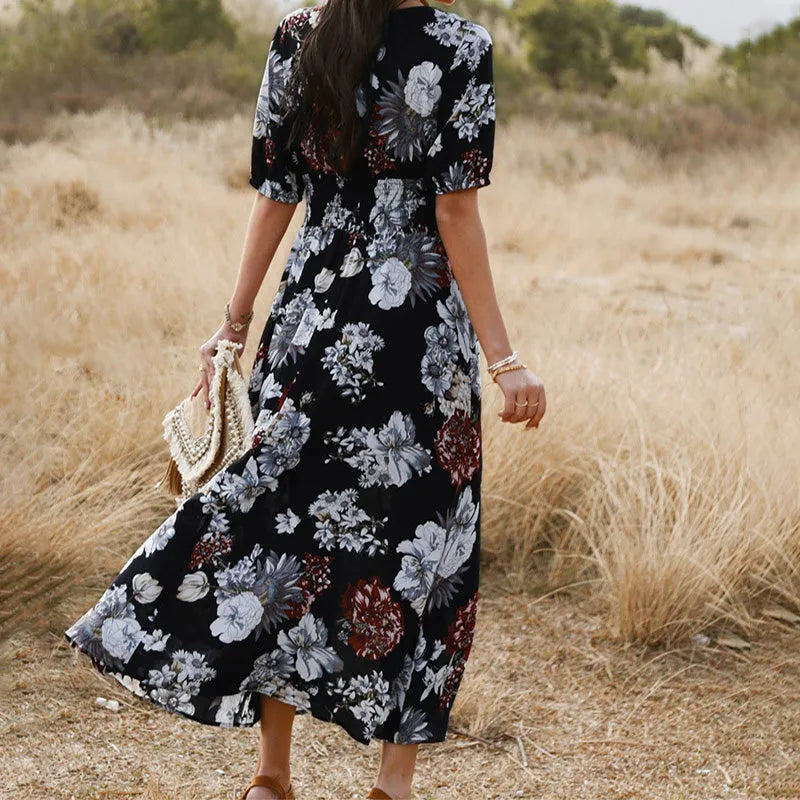 Women's yellow floral print summer dress with V neck and elastic waist on a mannequin.