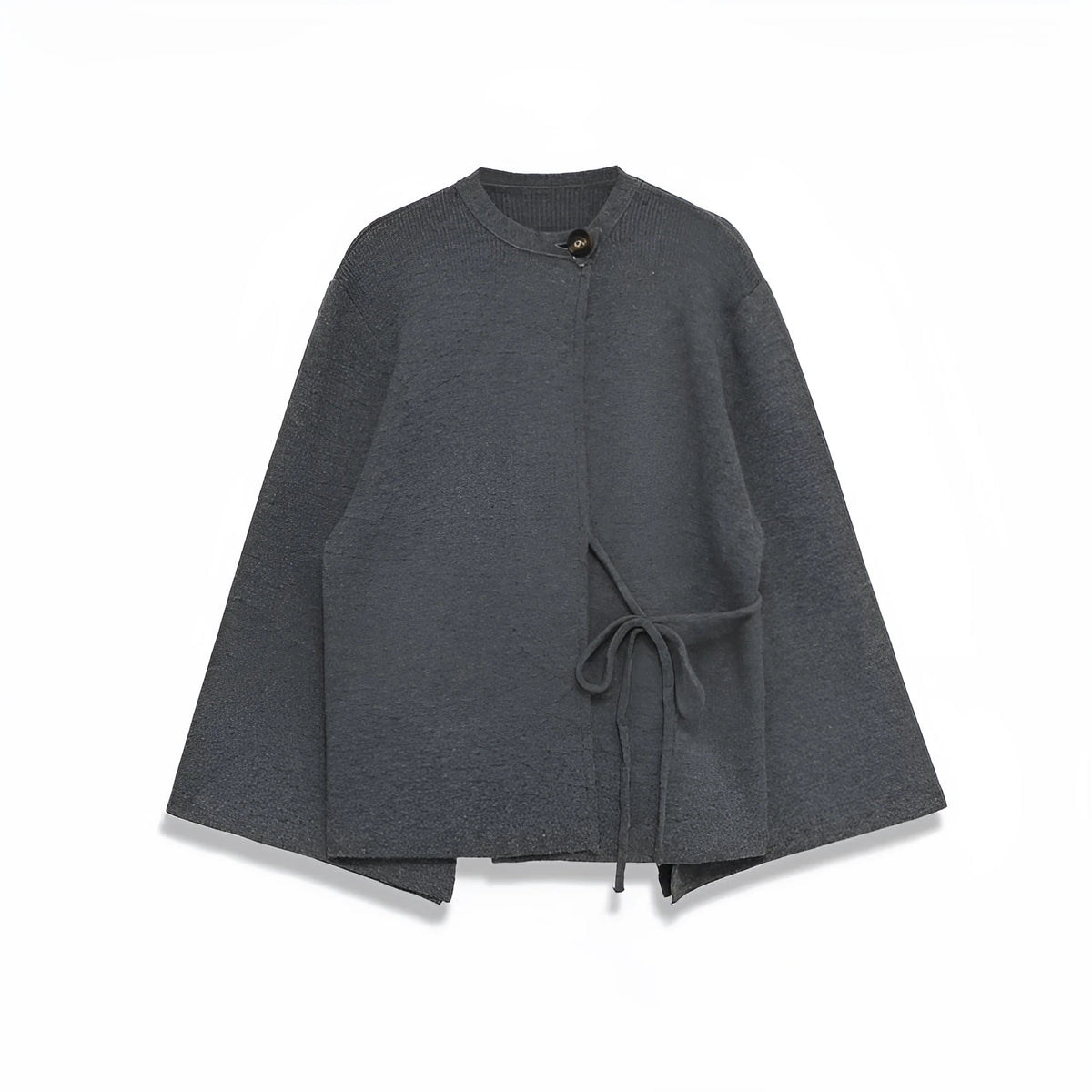Women's long gray knitted coat with slit sleeves and pockets on display