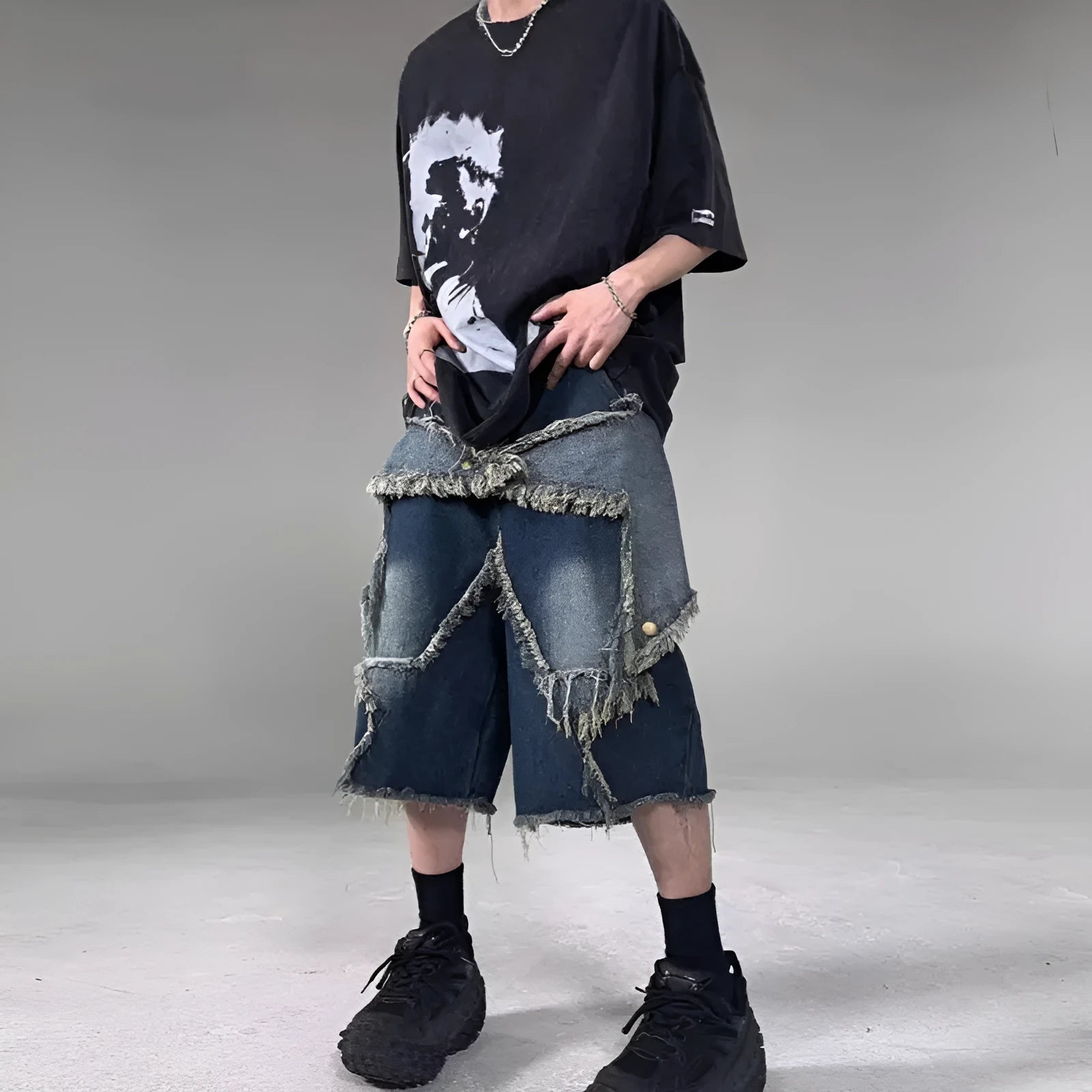 Blue American retro denim shorts with a frayed five-pointed star detail on the leg, shown in a loose fit.
