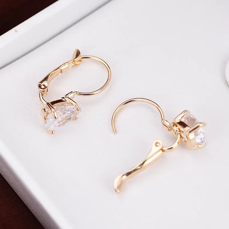 Women's drop-shaped copper earrings with gem inlay in gold and platinum colour options