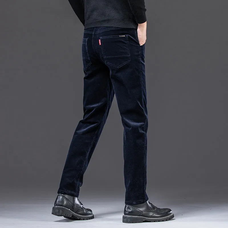 Straight slim-fit cotton corduroy trousers in black, side view, mid-waist, zip-placket fly