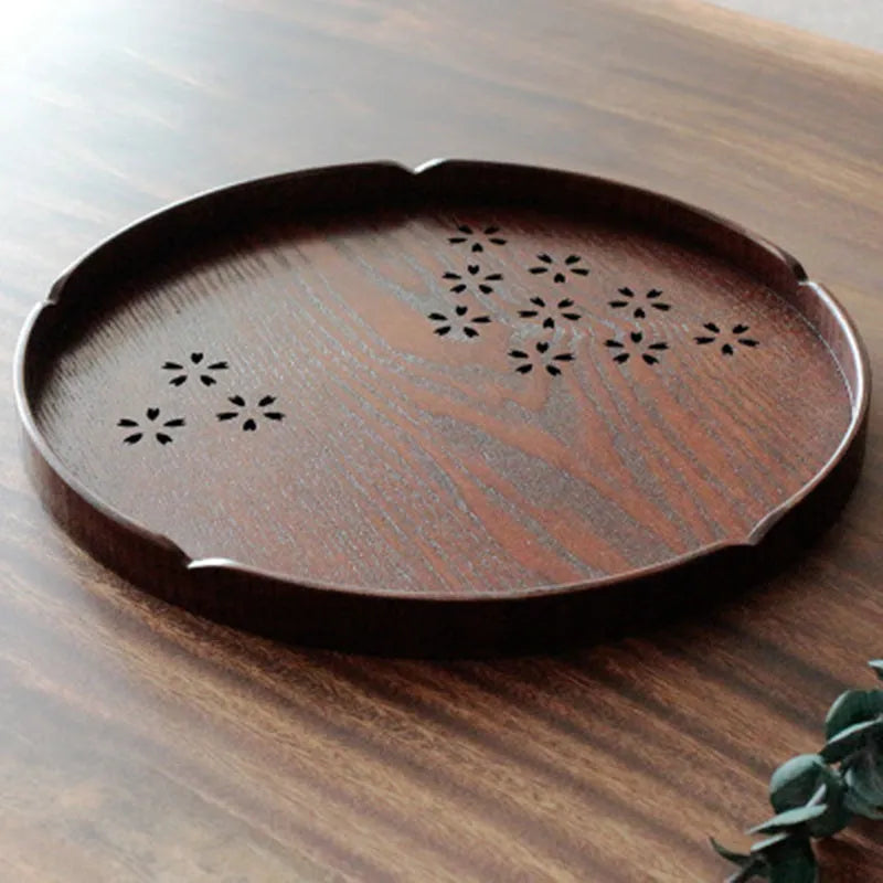 Wooden shallow plate with hollow cherry blossom design, 30cm diameter.