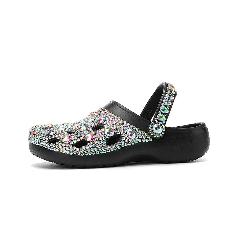 Black women's platform sandals with rhinestone detailing and a hole shoe design on an EVA sole.