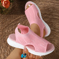 Women's platform sports sandals in black with a flat rubber sole and mesh lining.