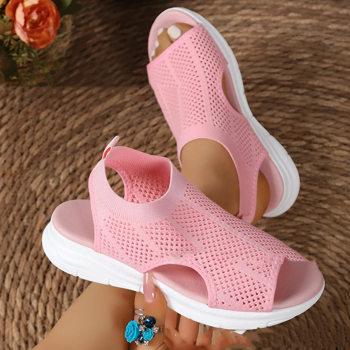 Women's platform sports sandals in black with a flat rubber sole and mesh lining.