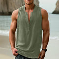 A mint green casual men's sleeveless shirt made from cotton and linen fabric on a hanger.