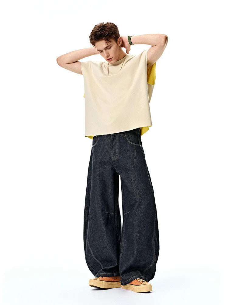 Men's wide leg denim trousers in original cow colour on a mid-waist model