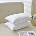White cotton satin stripe feather pillow with duck down filling showing striped fabric detail