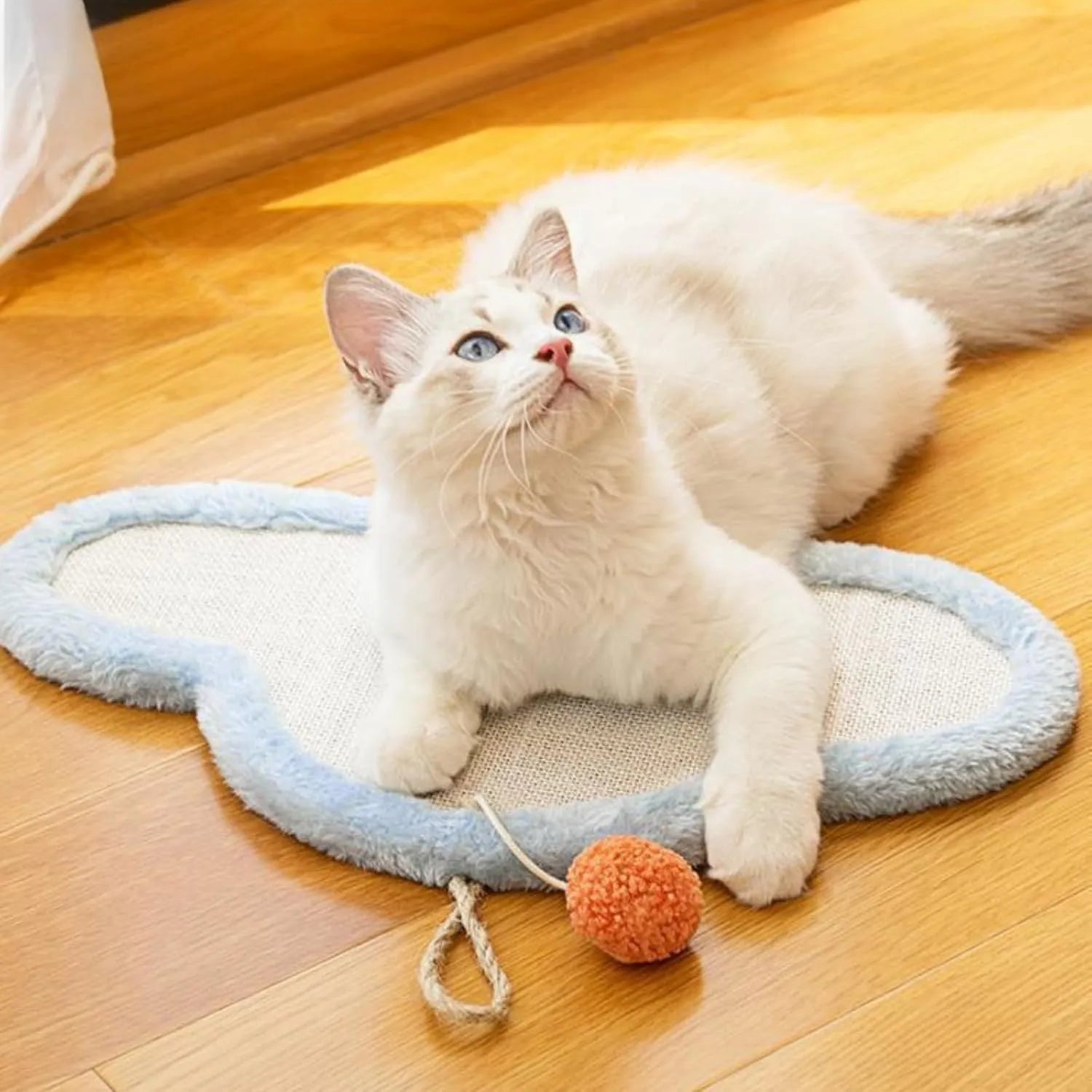 White cat scratching mat with sleeping cat design made from natural sisal material