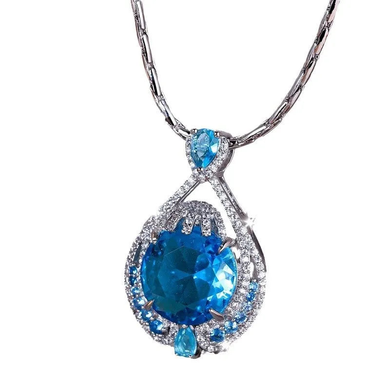 Blue geometric crystal necklace with fireworks-cut pendant on water wave chain