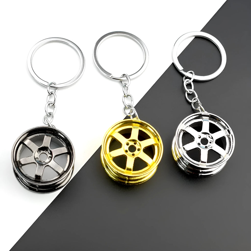 Creative car modification wheel hub metal keychain in gold finish on a keyring