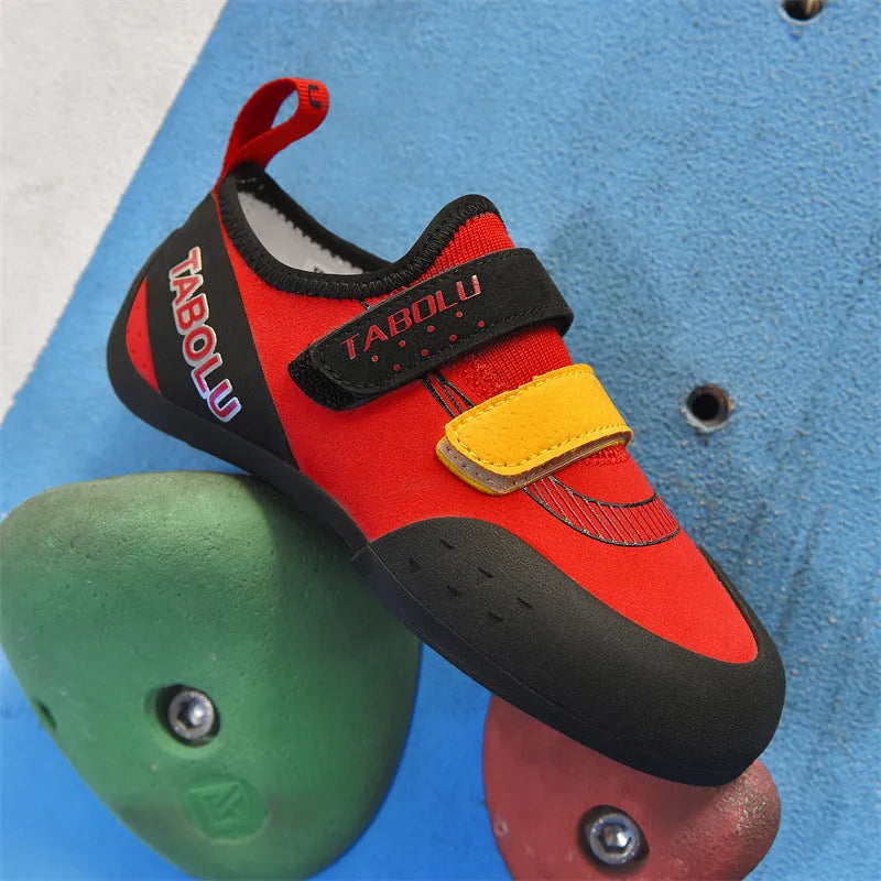 Men's and women's black beginner rock climbing shoes with coloured accents and Velcro strap