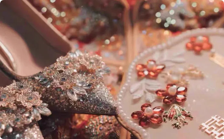 Champagne-coloured women's bridal shoes with rhinestone details, pointed toe, and a fine heel.
