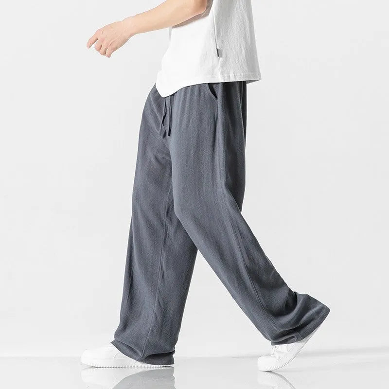 Men's light beige bamboo fibre straight-leg trousers with cropped length and drawstring waist on hanger