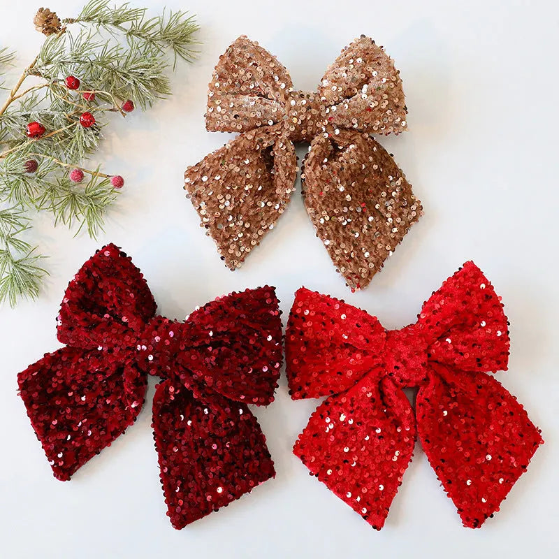 Polyester 25cm red paillette sequin bow Christmas decoration pendant hanging on a white background