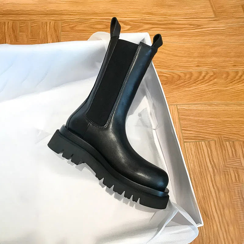 Women's black mid-calf boots with chunky low heel, round toe, and wear-resistant rubber sole in British style