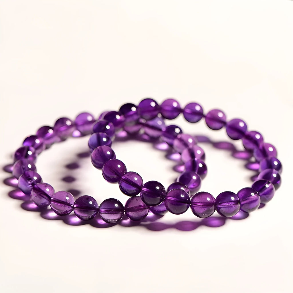 Polished natural Uruguay amethyst bracelet with scattered beads, showing different single circle and multi-ring models.
